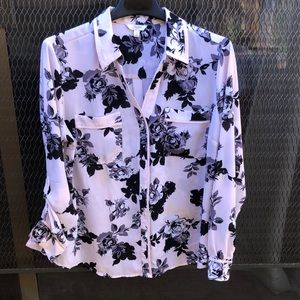Women’s cream colored blouse with black flowers